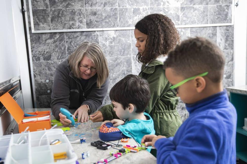 Students inside the Mobile Innovations Lab exploring hands on STEM activities