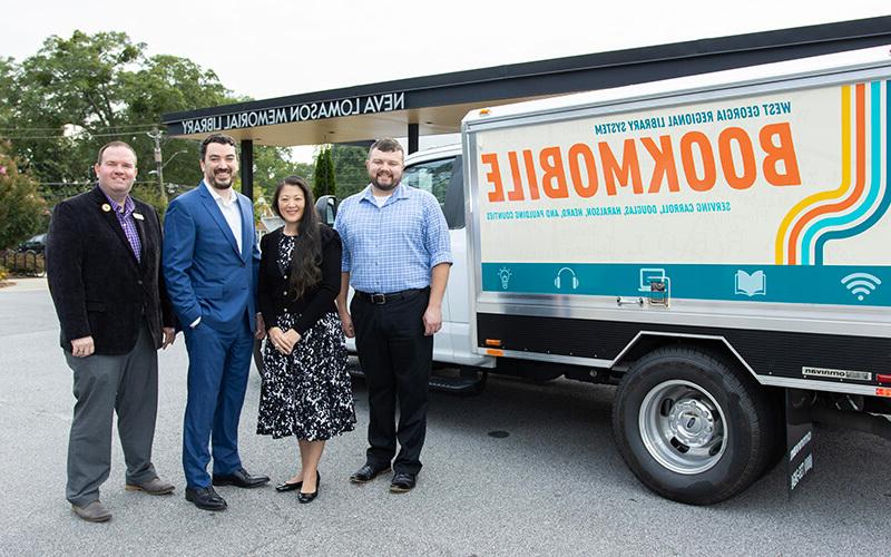 L to R: Duane Theobald, 博彩平台推荐 Center for Economic Education and Financial Literacy program manager; Kim Holder, 博彩平台推荐 Center for Economic Education and Financial Literacy director; Stephen Houser, WGRLS director; and Justin Nobles, WGRLS head of patron experience. Photo by Steven Broome.